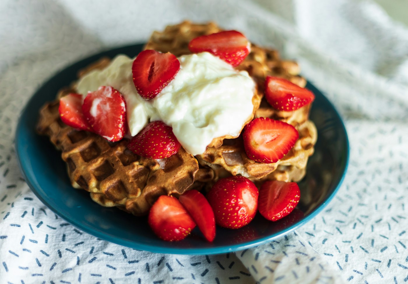 Waffles with strawberries and cream